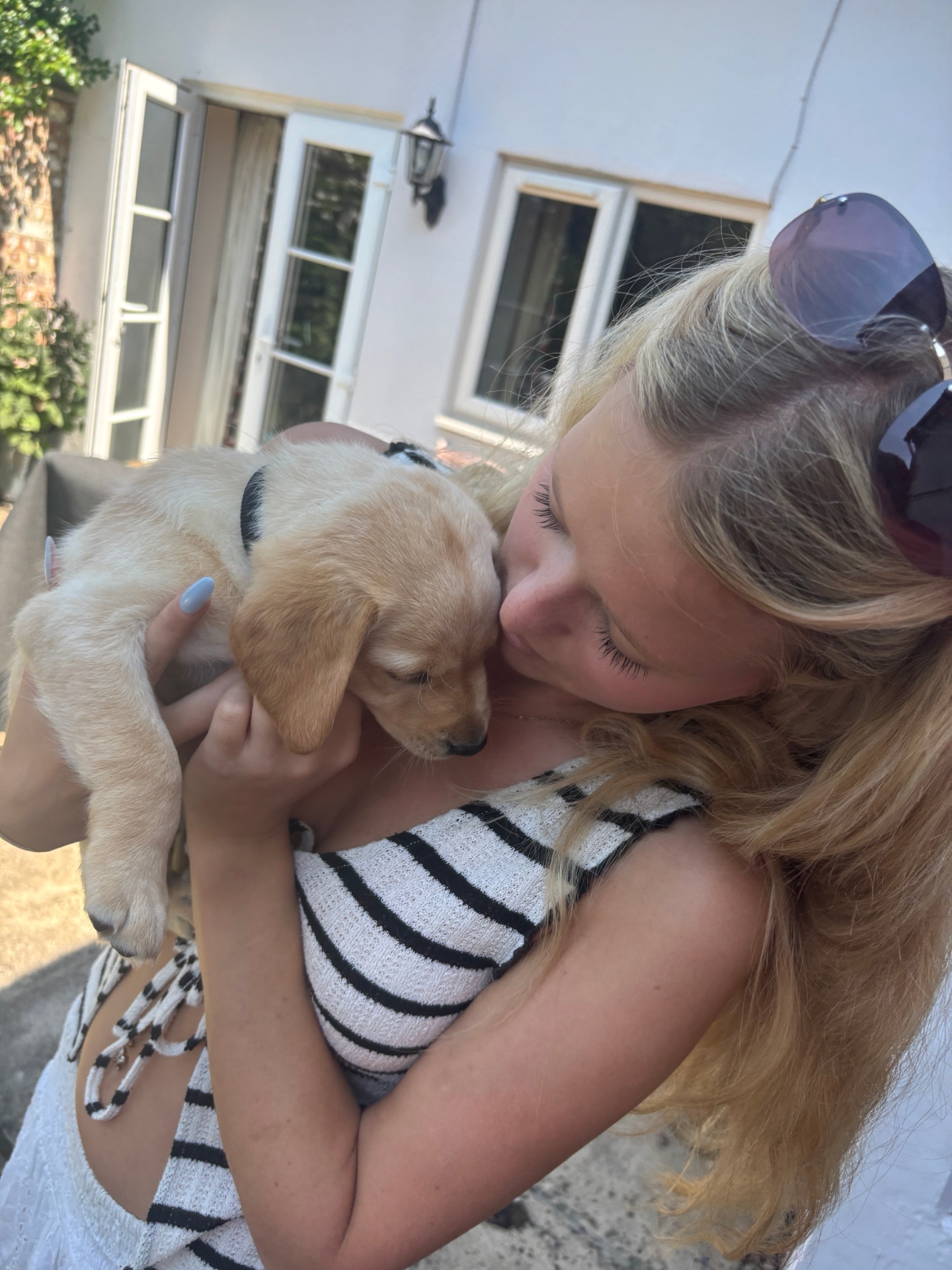 Coco with a puppy in her care